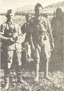 black and white photograph of several men in uniform