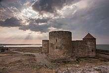 A fortress built of bricks, with two bastions and a tower