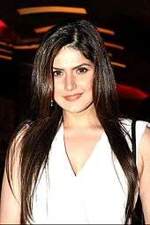 Zarine Khan looks down at the camera