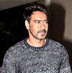 Ajay Devgan posing for an event