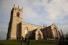 A stone church with tower