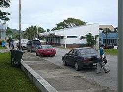 Alofi locals walking along a street