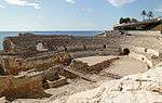 Ruins of an amphitheatre near the sea.