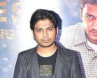 Ankit Tiwari is looking at the camera