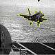 Photo of fighter jet landing on an aircraft carrier