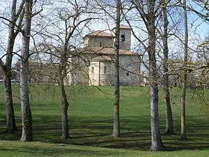 Large church, photographed through trees