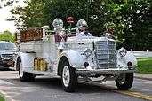 A white 1940s fire truck