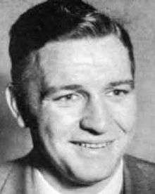 Head shot of Bob Woodruff, white man in his early to mid-30s, shown in a suit jacket and tie