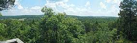 A panorama of the forest valley to the south from an overlook along the trail