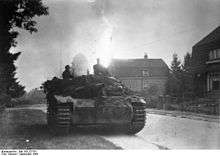 Assault gun parked at the side of the street with houses across the road