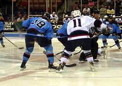 South Carolina Stingrays and Charlotte Checkers battle for control of the puck at a center ice face off; Charlotte Checkers at South Carolina Stingrays, April 17, 2009.