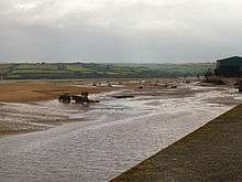 Dredging sand from the nearby Town Bar using a tractor