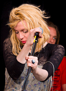 Colour photograph of Courtney Love performing live in 2010.