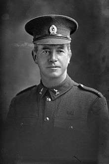 Black and white portrait of a man wearing a military uniform.