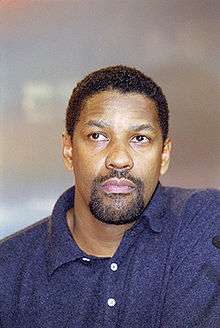 Denzel Washington in a blue shirt.