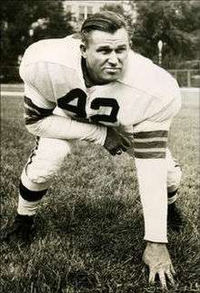 Palmer in a three-point stance in a Browns uniform, circa 1950