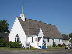 Photograph of a white, wooden church