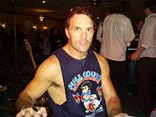 A picture of Doug Flutie posing.