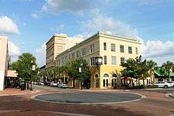 Intersection viewed diagonally with remodeled building on opposite corner