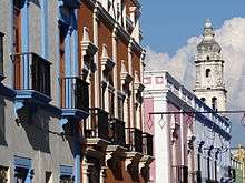 Brightly colored houses with balconies.