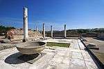 Ruins of a building with columns.