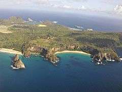 Rocky coast interspersed by sand beaches.