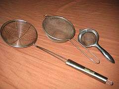 Several wire meshes shaped like bowls, with metal handles.