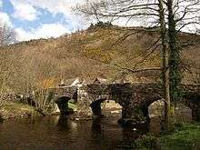 a picture of the bridge showing its stone piers and three arches with pedestrian refuges above the piers