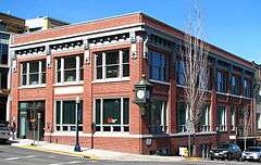 Photograph of the First National Bank of Hood River bulding, a two-story brick building on a city street corner