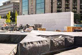 image of a black granite star-shaped fountain under construction