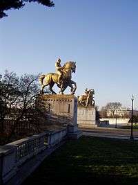 looking north at statues of horses on pedestals