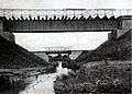 A black-and-white photograph of bridges over the Niemica River.