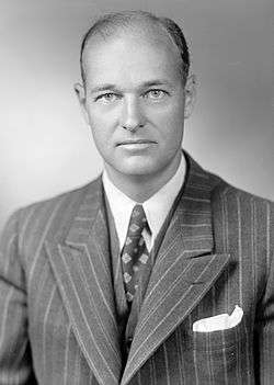 Head and shoulders portrait of a dignified man in his forties, wearing a suit and tie.