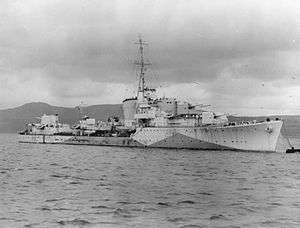 a black and white photograph of a warship at sea