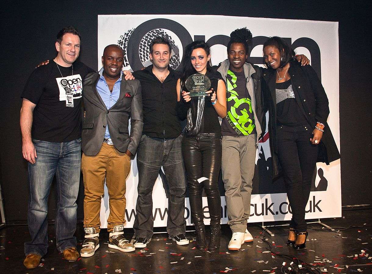 Ras Kwame (center) as judge at Open Mic UK, 2010