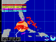 Map showing areas under the effect of tropical cyclone watches and warnings as denoted by highlighted borders. The hurricane's wind field, shown in contours, is also displayed.