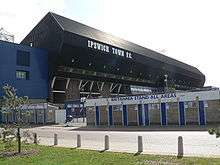 The East of England Co-operative stand with several turnstiles in front of it