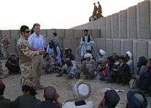 King (centre) speaking in Afghanistan, 2009