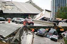 Perhaps a dozen cars in view of the wreckage