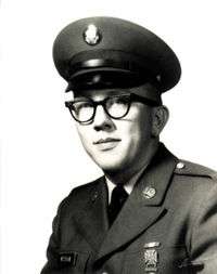 A black and white image showing the head and upper torso of Wickam wearing his military dress uniform with hat.