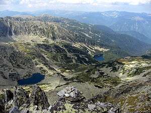 Aerial photo of mountains, valley and two lakes