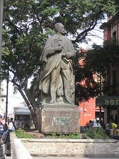 A bronze statue in a street