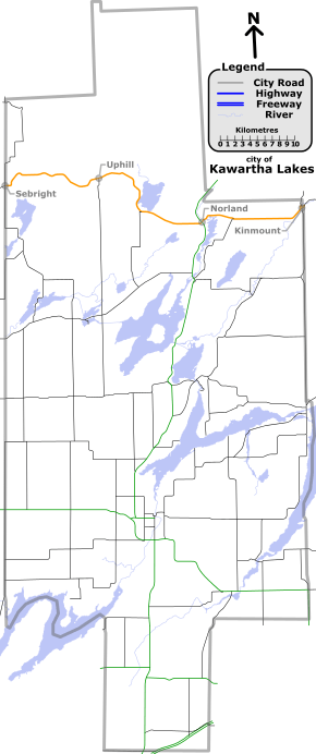 "A map with various coloured lines representing different types of roadways. In deep-green are provincial highways. In black are other Kawartha Lakes numbered roads. In orange is Kawartha Lakes Road 45. Lakes and rivers are light-blue."