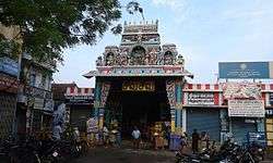 Image of a temple entrance in a busy street