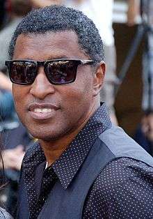 Babyface smiling, wearing black sunglasses