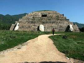 Ruins of a low step-pyramid like structure.