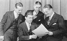 Very early picture of the Landt Trio & White showing Karl, Jack, and Dan standing, Howard White seated.