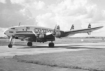 A Trans World Airlines L-749A at London's Heathrow Airport. Note the "Speedpak" under fuselage freight container.