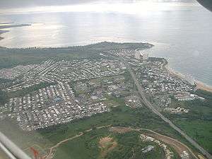 Aerial view of a coastal city from inland