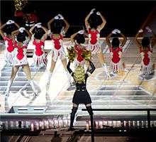 Madonna and dancers, seen from behind